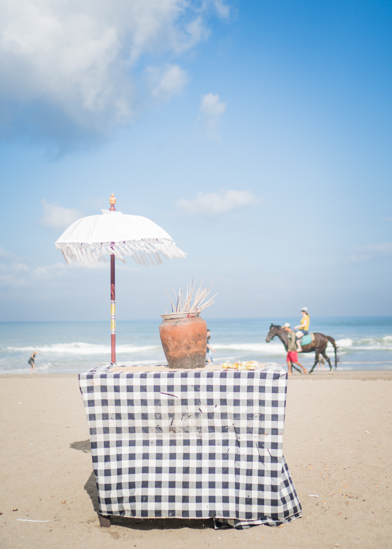 nomadic lifestyle - horse and display of respect to gods at Bali beaches