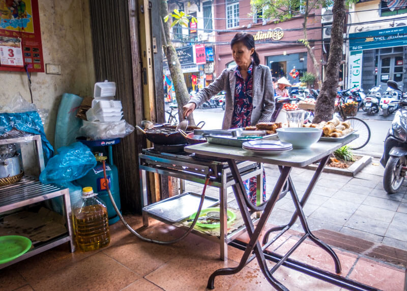 Best Food Hanoi Vietnam - vendor frying spring rolls