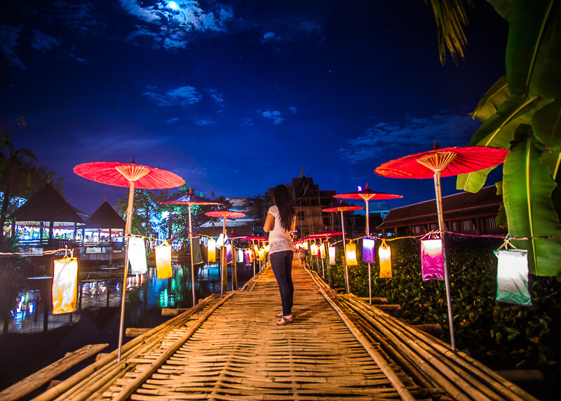 semi-nomadic life in chiang mai - asian girl on bamboo path lanterns full moon